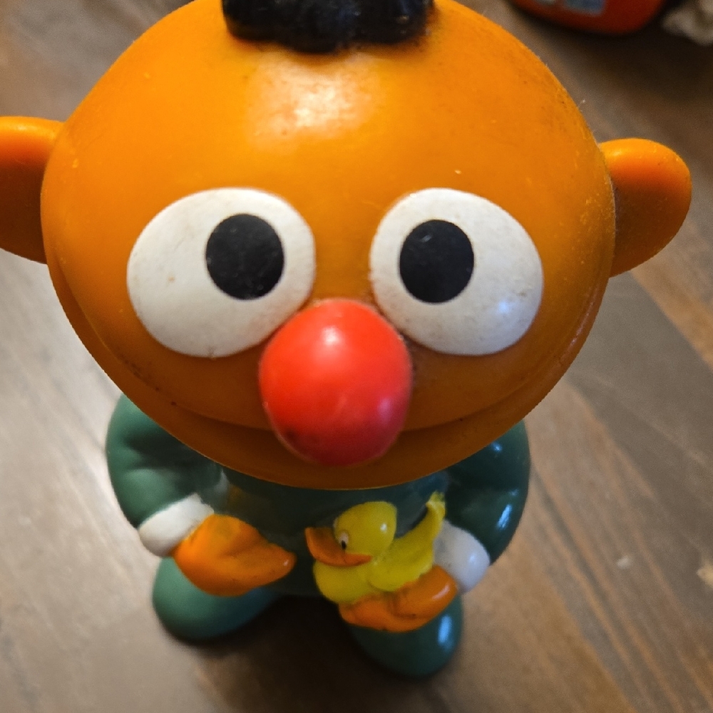 Orange and Green Character Figurine